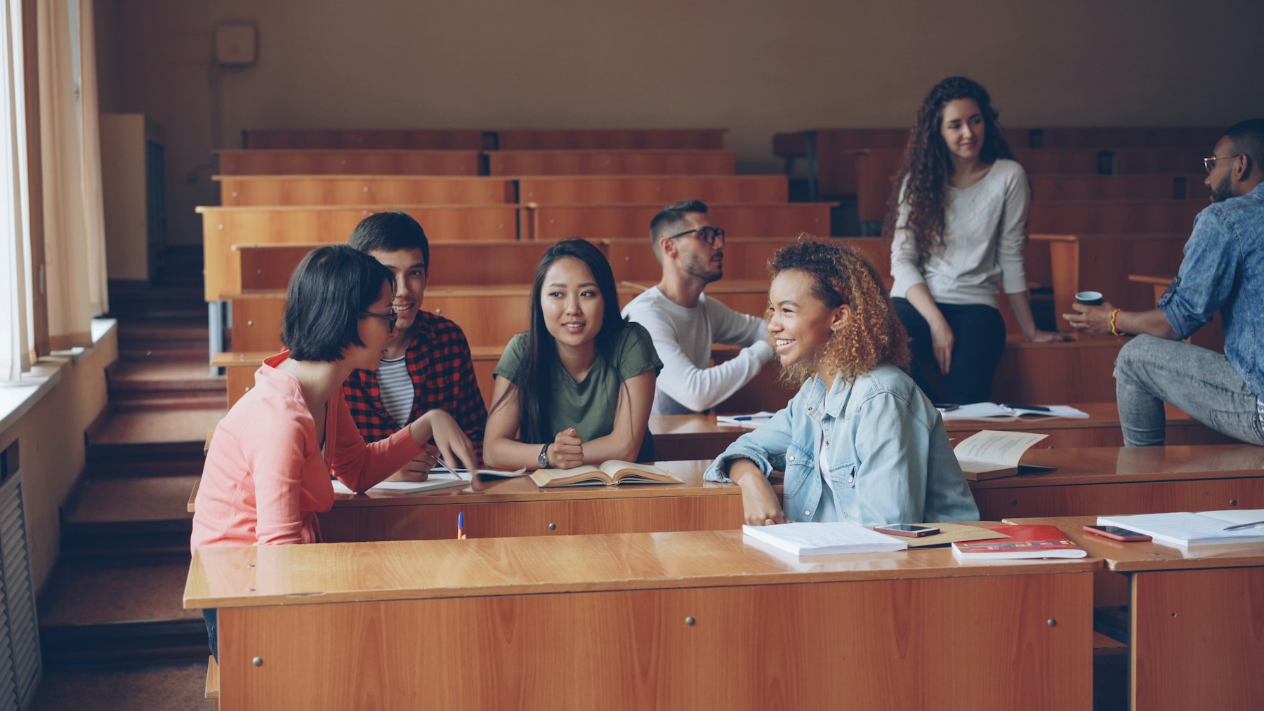 University students in conversation during a lecture-hall break