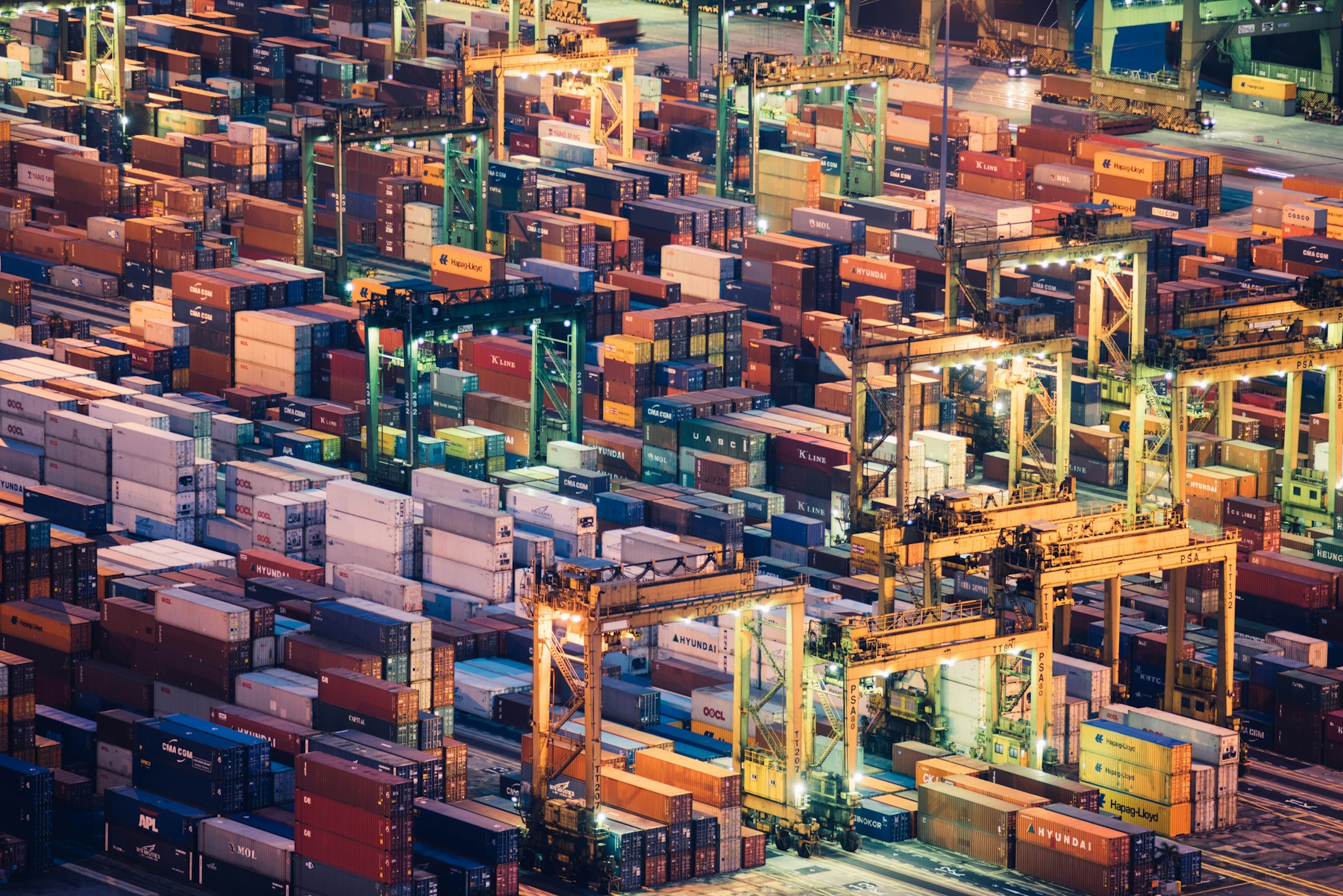 Aerial view of a working container port and cross-border logistics infrastructure