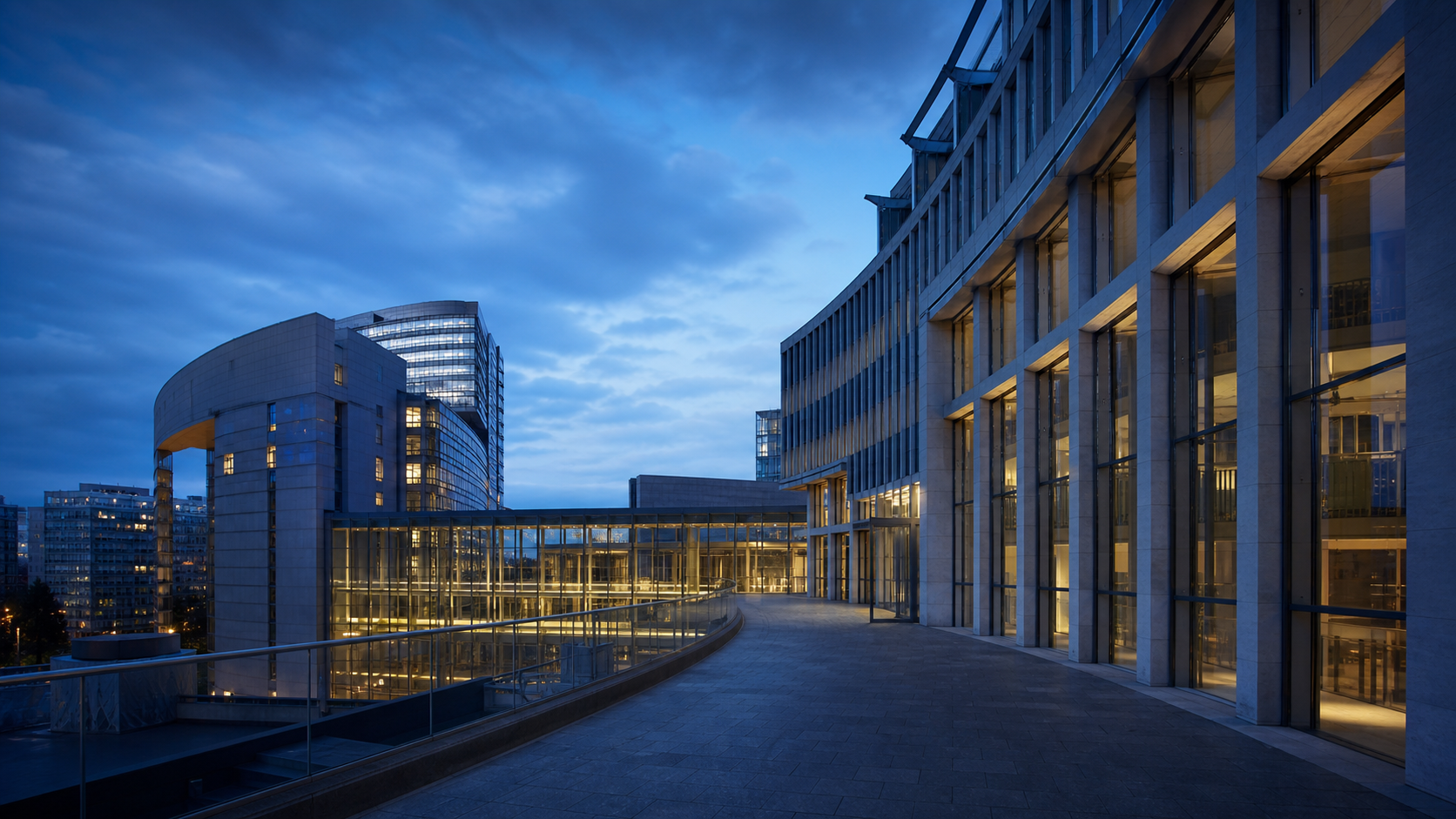 Contemporary European civic and international-business architecture at blue hour
